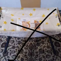 گهواره و تشک نوزاد