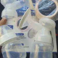 شیردوش برقی و شیشه شیر