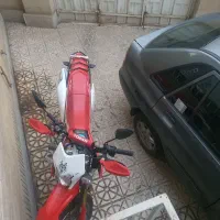 پراید ۱۴۱دوگانه وموتورسیکلت توسان باسل۲۵۰