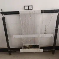 دار قالی با نقشه و نخ