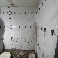 کاشی کاری سنگ کاری گچ کاری دیوار چینی تخریب بنایی