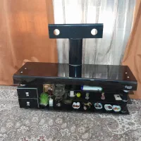 زیر تلویزیونی شیشه ای