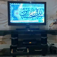 میز شیشه ای تلویزیون