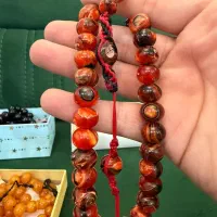 تسبیح کهربای پرچمی رگه دار با مهرنقره