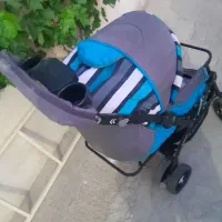 کالسکه کودک دارای کمربند محافظ
