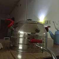 کتری شیر دار با قوری چینی .
