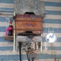تعمیرات  بخاری و ابگرمکن  دیواری گاز صفحه ی