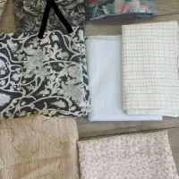 تعدادی پارچه چادری دوتا قواره پارچه پیراهنی